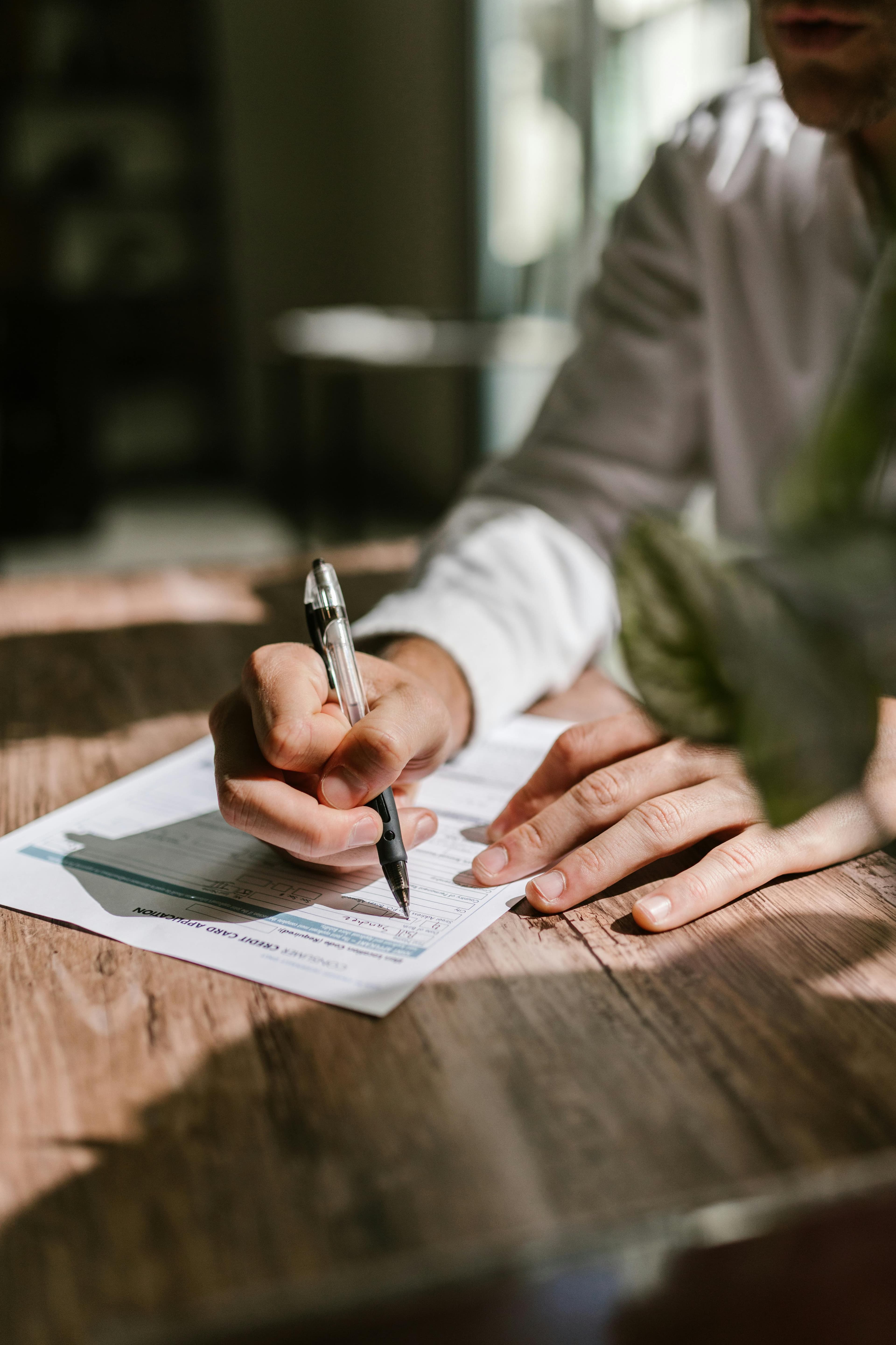 Person holding professional books and notebooks