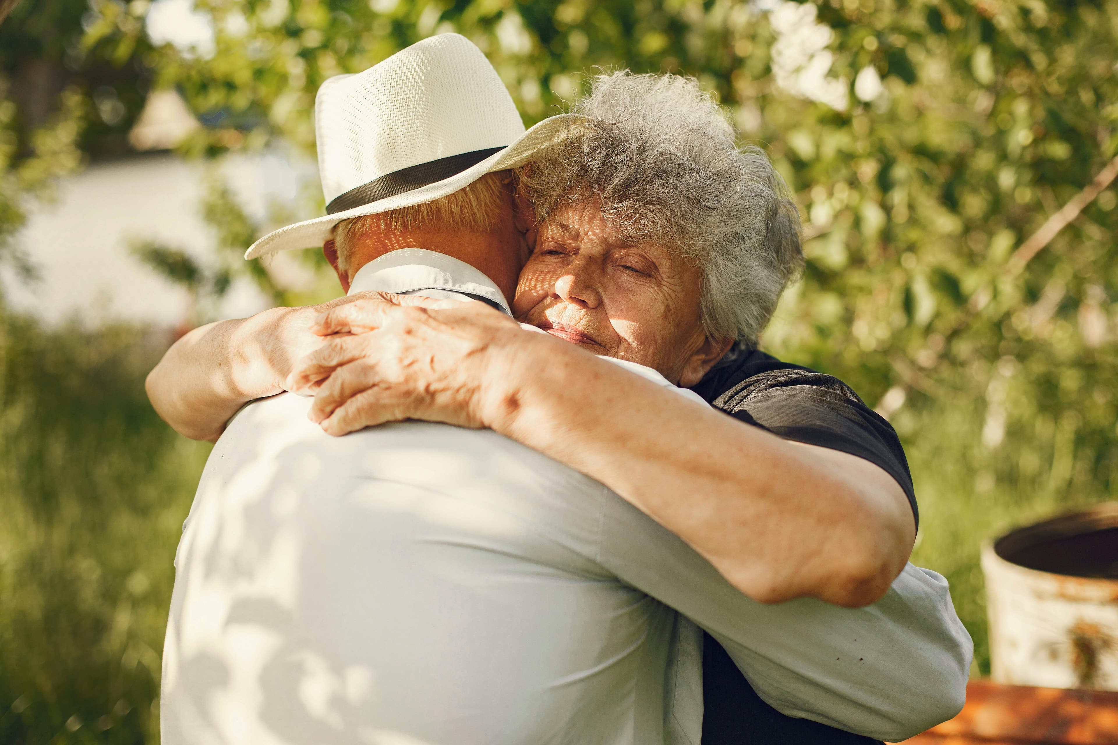 Two people holding each other in a tender embrace