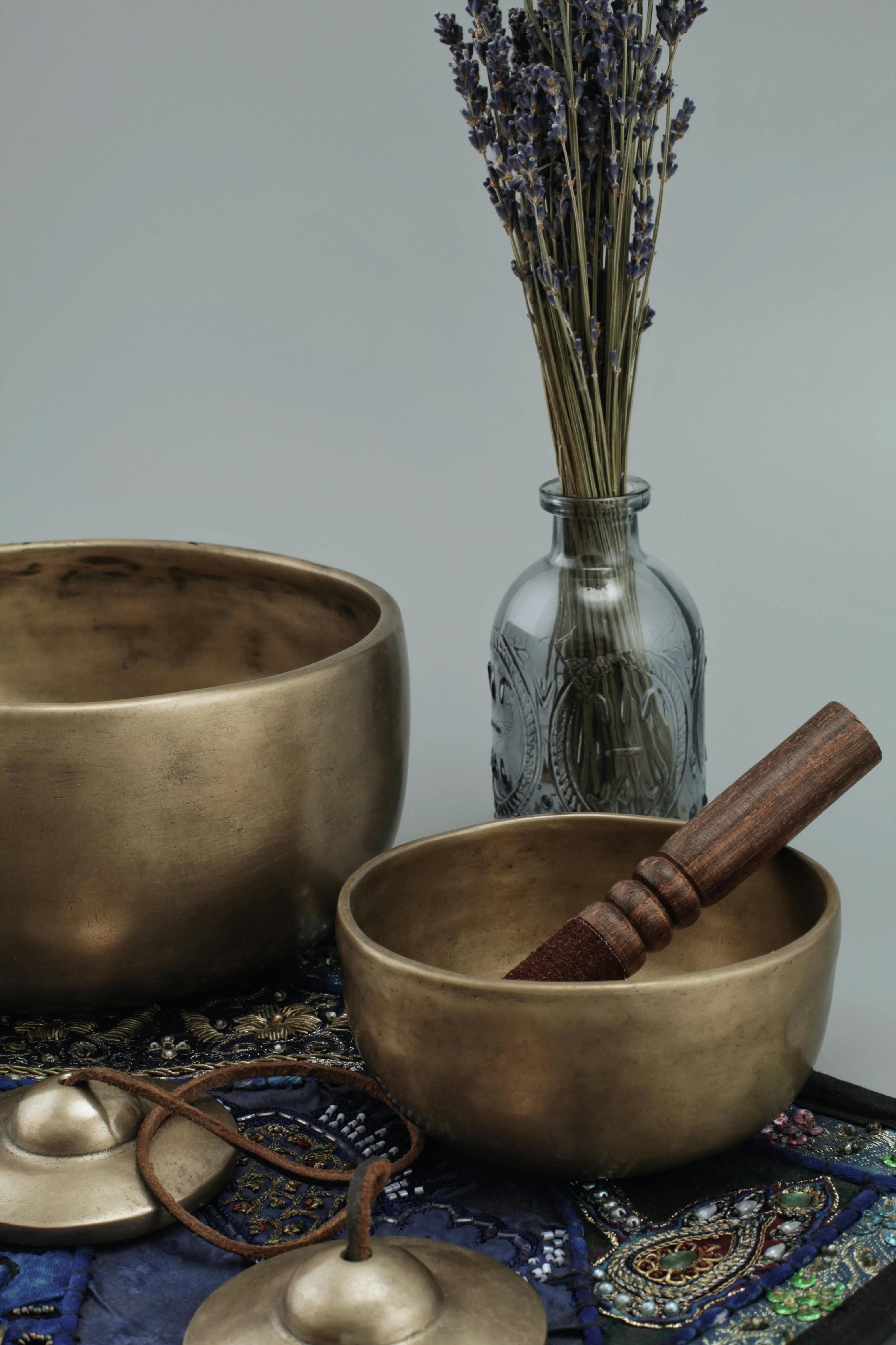 Vintage gramophone with velvet chair and flowers by a window
